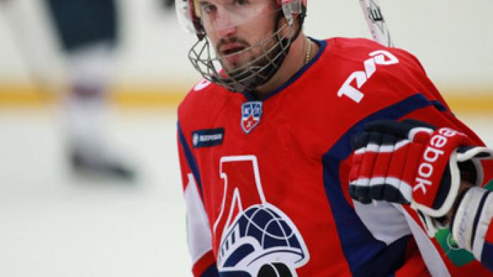 Crash-survivor hockey player stable, in induced coma