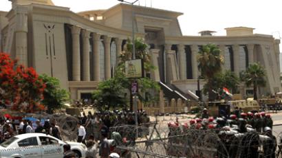 Morsi calls power extension 'temporary' as Egyptians swarm streets in protest