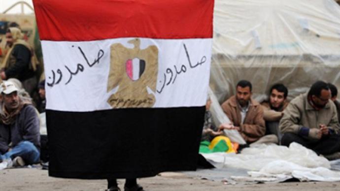 Egypt takes first steps toward exit from two-week turmoil
