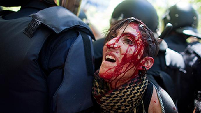 Over 70 injured as protesters clash with police in Madrid