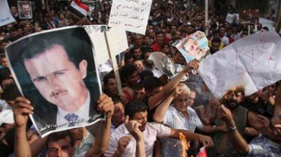 Pro-Assad rally draws thousands to Syrian capital