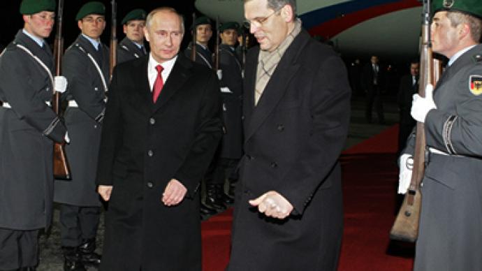 Putin talks post-crisis economy with Merkel