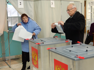 United Russia wins polls under new rules, opposition cry foul