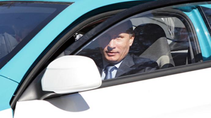 Putin takes Russian hybrid car for a test drive