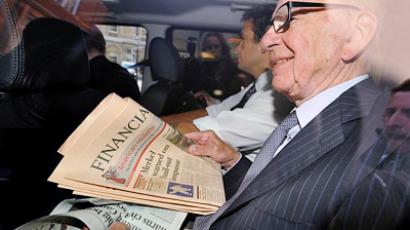 Rupert Murdoch hit with shaving cream during Parliament hearing
