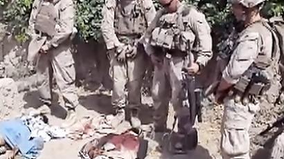 US troops defile Afghan corpses again, pose with body parts