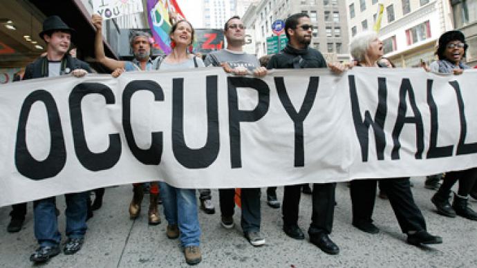 Occupy Wall Street to rubber stamp money with anti-corporate slogans