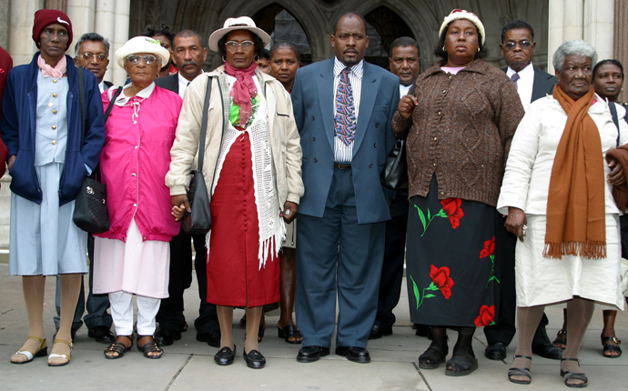 A group of refugees from the Indian Ocean island of Chagos gather outside the High Court in London on October 31, 2002. They are seeking compensation from the British government for forcibly removing them to make way for the Diego Garcia U.S. military base 30 years ago (Reuters / Michael Crabtree)