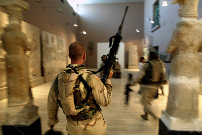 Two US soldiers from the 1st Division, 2nd Bridage, Texas, visit the Iraq Museum 10 September 2003 in Baghdad. (AFP Photo)