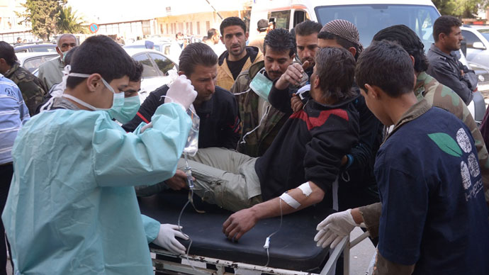 Man is brought to a hospital in the Khan al-Assal region in the northern Aleppo province, as Syria's government accused rebel forces of using chemical weapons for the first time. The opposition denied the claim, saying instead that government forces might have used banned weapons.(AFP Photo / HO-SANA)