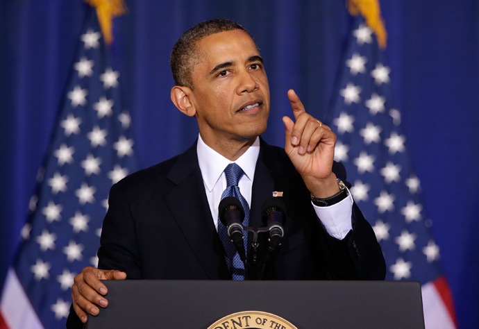 U.S. President Barack Obama listens as Medea Benjamin, an activist from the organization called Code Pink, shouts at him while he speaks at the National Defense University May 23, 2013 in Washington, DC (Win McNamee / Getty Images / AFP)