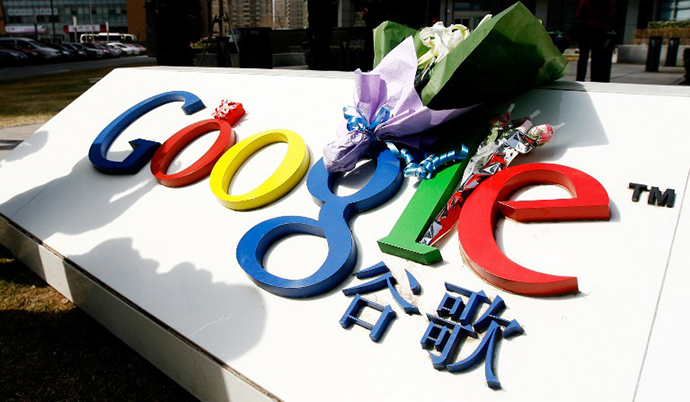 A bouquet of flowers lies on the Google logo outside the company's China head office in Beijing on March 23, 2010 after the US web giant said it would no longer filter results and was redirecting mainland Chinese users to an uncensored site in Hong Kong â effectively closing down the mainland site. (AFP Photo / Li Xin)