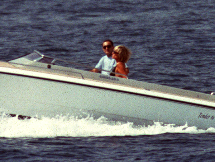 A couple identified as Diana Princess of Wales and Egyptian businessman Dodi Al Fayed cruise off the coast of Saint Tropez, Southern France, August 22. Lady Diana is in Saint Tropez on her fourth summer holiday in six weeks. (Reuters)