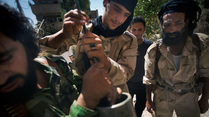Rebel fighters prepare explosive devices to be used during fighting against Syrian government forces on September 7, 2013 in Syria's eastern town of Deir Ezzor.(AFP Photo / Ricardo Garcia Vilanova)