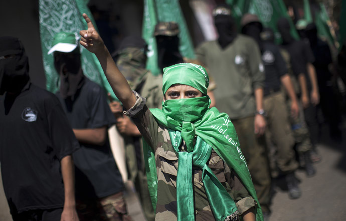 A Palestinian child takes part in a march organised by the ruling Islamic Hamas movement in Gaza's Nusseirat refugee camp on September 27, 2013 in commemoration of the September 28, 2000 outbreak of the devastating second intifada. (AFP Photo)