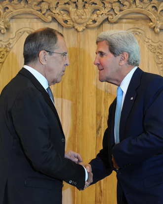 US Secretary of State John Kerry (R) shakes hands with Russian Foreign Minister Sergei Lavrov during their press conference on the sidelines of the APEC Summit in Nusa Dua on Indonesia's resort island of Bali on October 7, 2013 (AFP Photo / Sonny Tumbelaka)