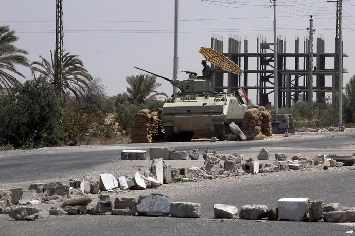 An Egyptian soldier stands guard at a checkpoint in Rafah city on the Egyptian border (Reuters)