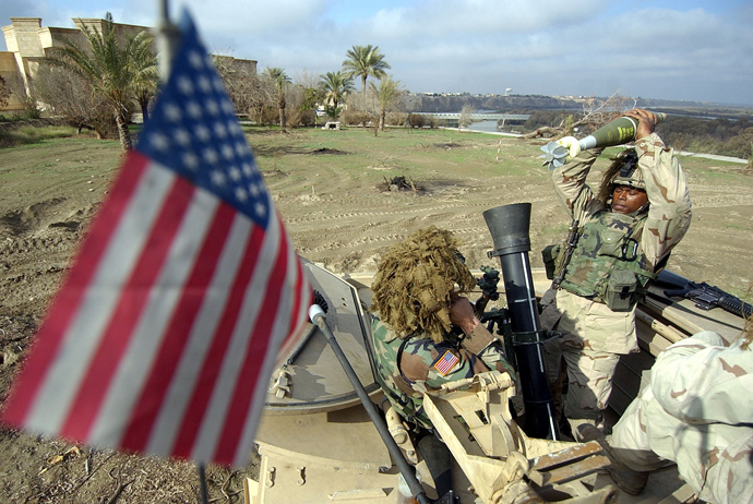 US soldiers from the 1st Battalion, 22nd Regiment of the 4th Infantry Division prepare to fire a mortar during training at their base in Tikrit, 180 Kilometers (110 miles) north of Iraqi capital Baghdad, 29 December 2003 (AFP Photo / Jewel Samad)