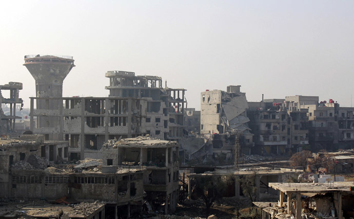 Damaged buildings are seen in the Damascus suburb of Arbeen January 1, 2014. (Reuters/Ammar Al-Erbeeni)