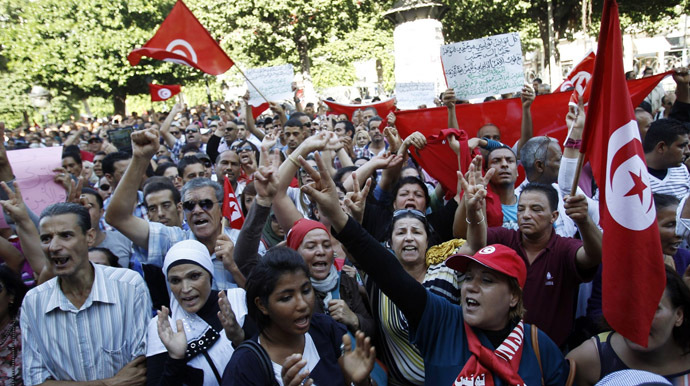 Protesters shout slogans during a demonstration after seven policemen were killed during clashes last week in Sidi Bouzid, as they gather at the central Habib Bourguiba Avenue in Tunis October 28, 2013. (Reuters)