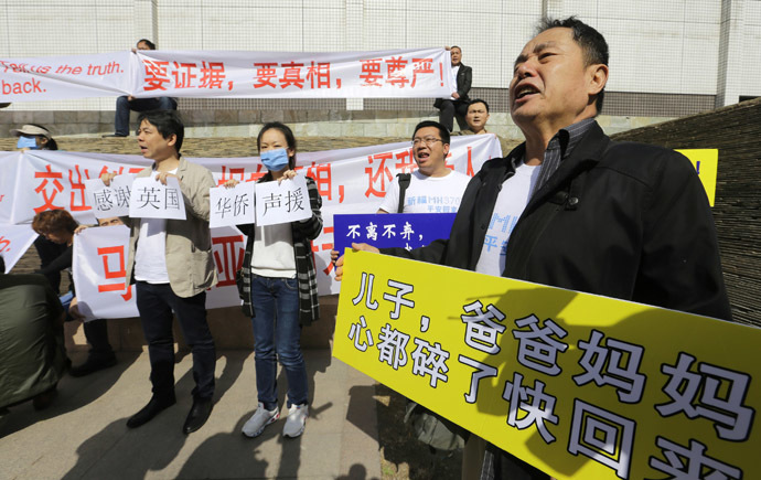 A family member of a passenger onboard the Malaysia Airlines Flight MH370 shouts slogans during a protest outside Lido Hotel in Beijing March 29, 2014. (Reuters)