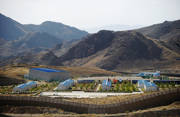 A camp set up by the Chinese mining company sits mostly empty near a protective wall a few kilometers away from an ancient Buddhist site where a religious community set up more than 17 centuries ago to exploit the copper deposits in the arid mountains of Mes Ainak on October 10, 2012. (AFP Photo / Roberto Schmidt)