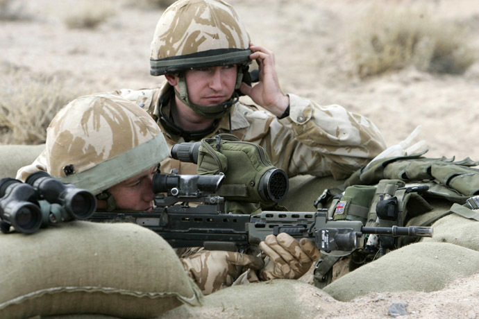British soldiers take up positions as they guard outside the presidential palace during a handover ceremony in Basra, 550 km (340 miles) south of Baghdad, December 16, 2007. (Reuters)