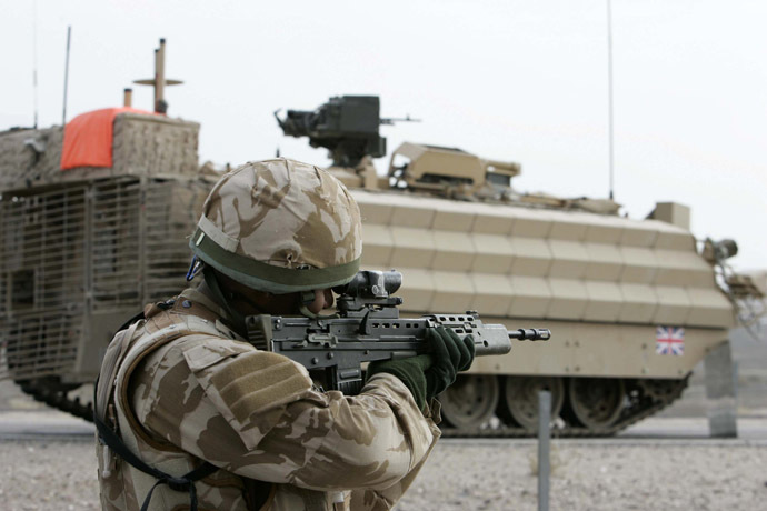 A British soldier takes up position before the start of the handover ceremony outside Basra's airport December 16, 2007. (Reuters)