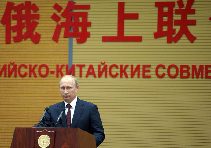 Russia's President Vladimir Putin speaks at the opening ceremony for the Naval Cooperation 2014 joint China-Russia naval exercise at a command center of the Wusong naval base in Shanghai on May 20, 2014.(AFP Photo / Alexey Druzhinin )