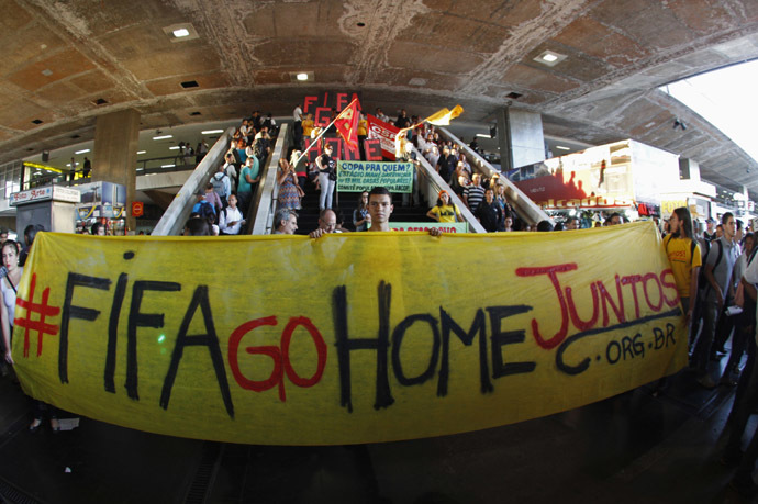 Demonstrators protest against the 2014 World Cup in front of a major bus terminal in Brasilia, May 15, 2014. (Reuters/Felipe Costa)