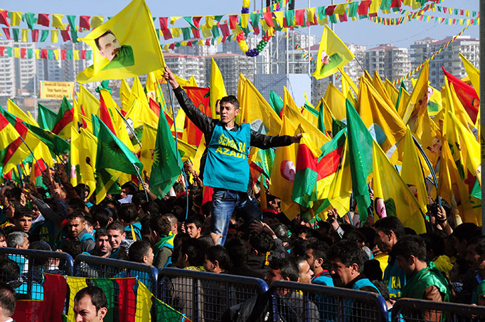 A Kurdish man waves a poster of founder of PKK (Kurdish Worker Party) Abdullah Ocalan during celebrations of Nowruz, the Persian New Year festival in Diyarbakir. (AFP Photo)
