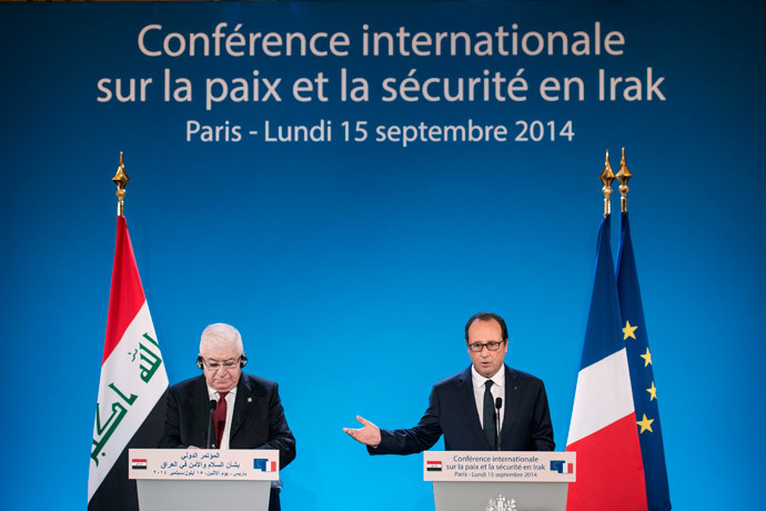 Iraqi President Faud Masum (L) listens while French President Francois Hollande speaks during the International Conference on Peace and Security in Iraq at the Quai dâOrsay on September 15, 2014 in Paris, France. (AFP Photo / Brendan Smialowski)