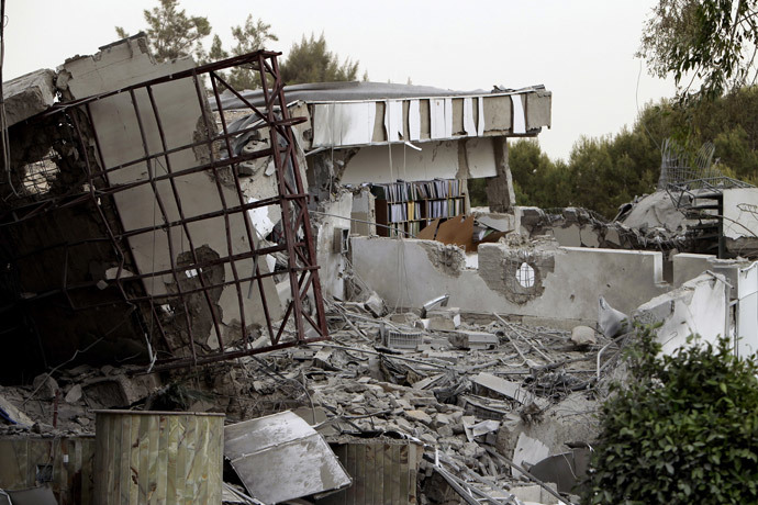 A picture shows the damaged offices of Libyan leader Moamer Kadhafi after they were hit by NATO bombs in the Bab Al-Aziziya district of Tripoli on April 25, 2011 (AFP Photo / Joseph Eid)