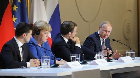 Angela Merkel, Emmanuel Macron, Vladimir Poutine et Volodymyr Zelensky, donnent une conférence de presse après un sommet sur l'Ukraine à l'Elysée, à Paris, le 9 décembre 2019.