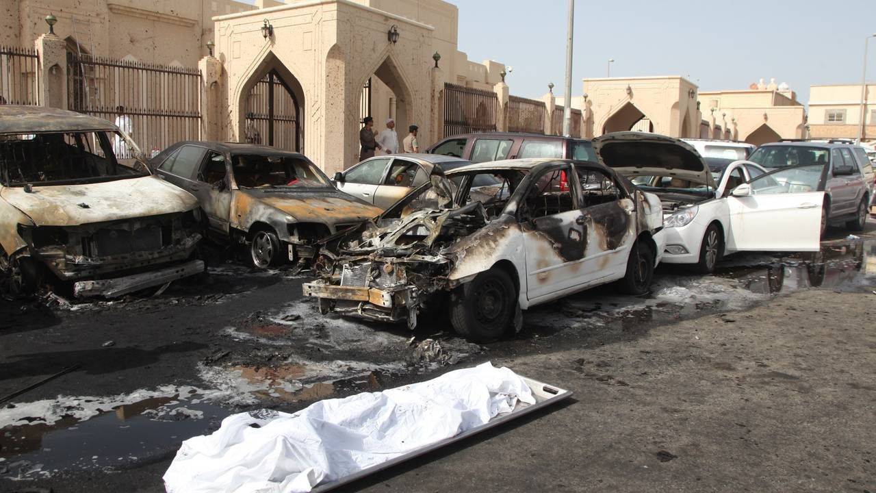 The remains of a body lie on a stretcher as Saudi security forces inspect the site of a suicide bombing that targeted the Shiite Al-Anoud mosque in the coastal city of Dammam on May 29, 2015. The Islamic State jihadist group claimed the suicide bombi